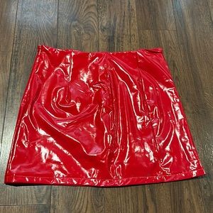 Short, red leather skirt.